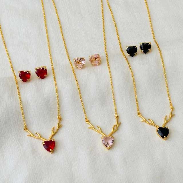 Three heart-pendant necklaces with matching stud earrings